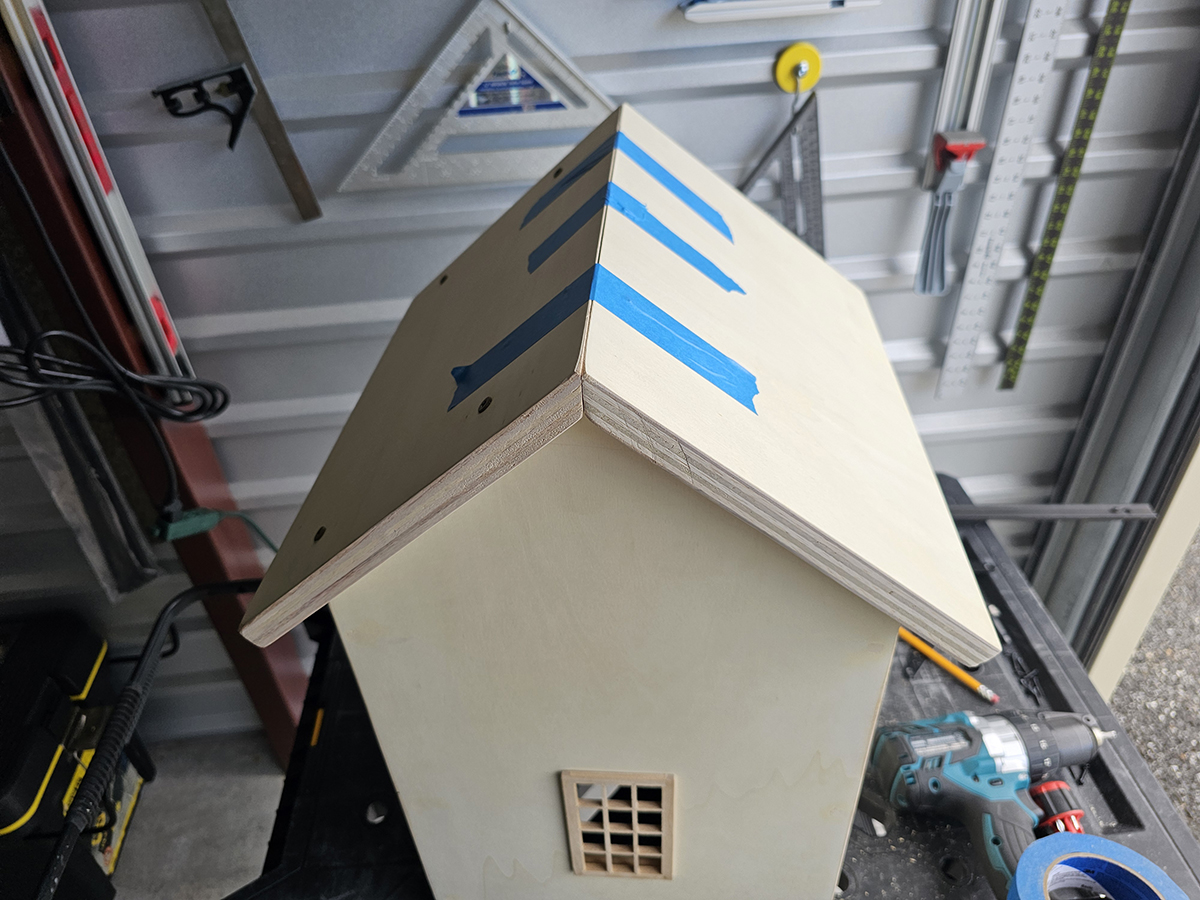 Final roof panels being attached to Cat Cabin